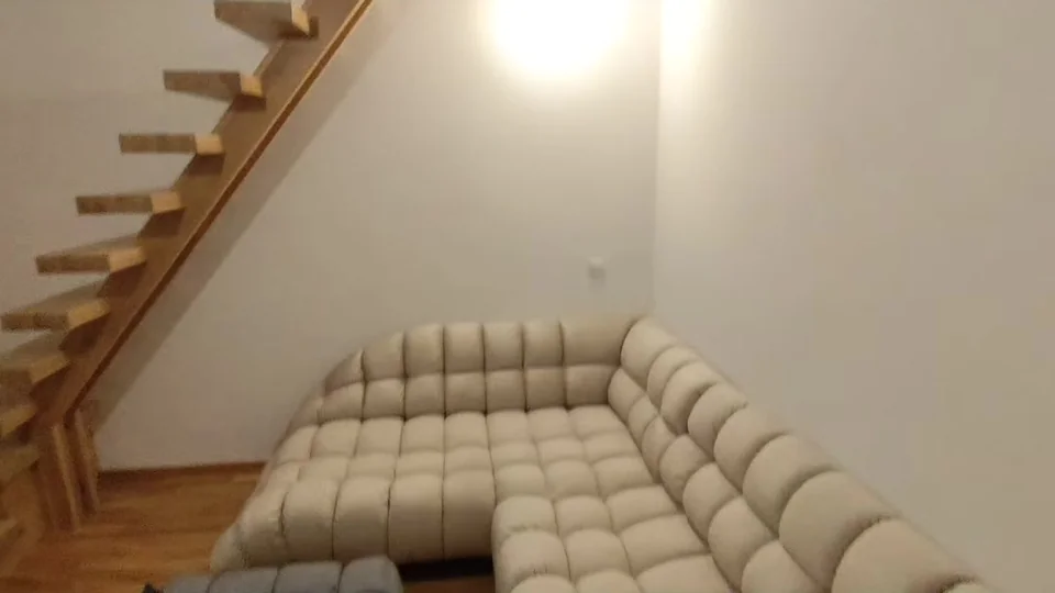 A502: Living area with stairs to the loft (video still)