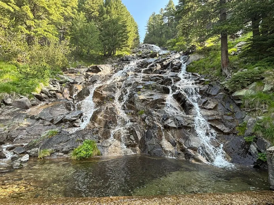 Karaalanitsa cascade descending across rock beside a concrete water structure.