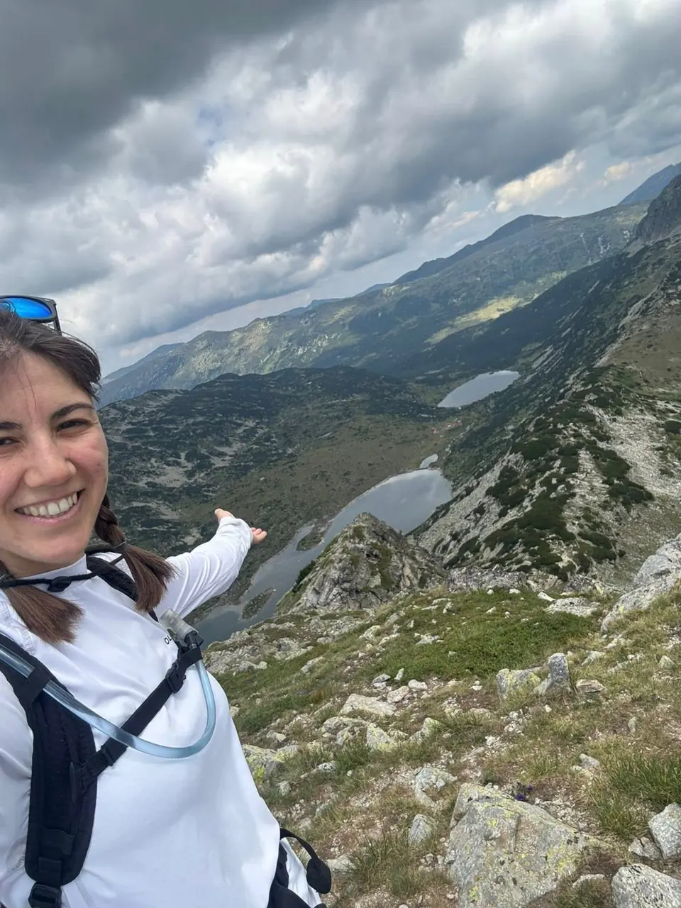 Walker selfie with a lake basin and ridges behind on the Kanarata outing.